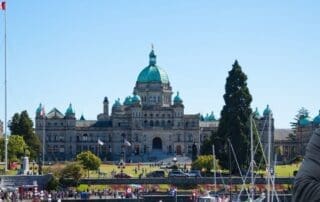 British Columbia Government Contractor Payment Terms Guide - businessman with BC in the background.