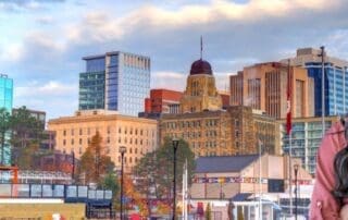 Guide to Nova Scotia Government Contractor Payment Terms - female government contractor with Nova Scotia in background.