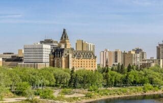 Guide to Saskatchewan Government Contractor Payment Terms - Businesswoman with Saskatchewan in background.