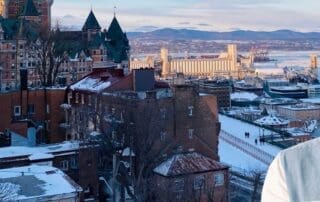 Quick Guide to Québec Government Contractor Payment Terms - business owner with Québec in background.