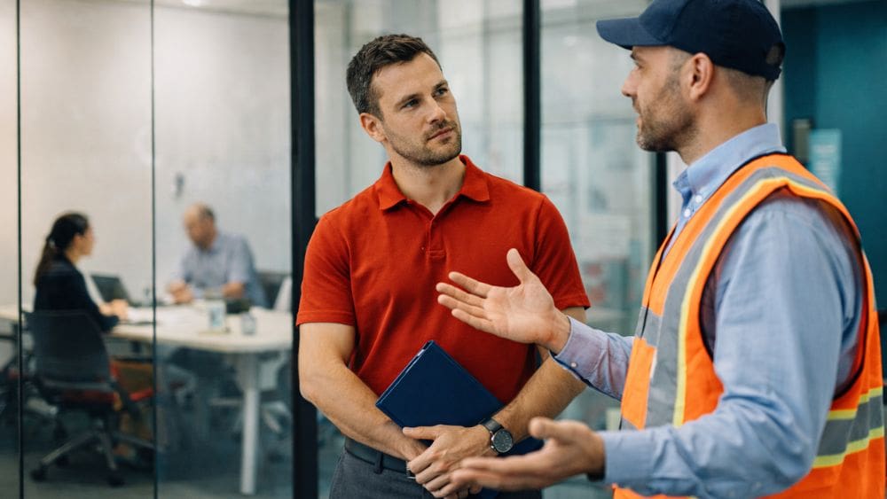 How to Manage Client Concerns About Factoring - Two men having a discussion
